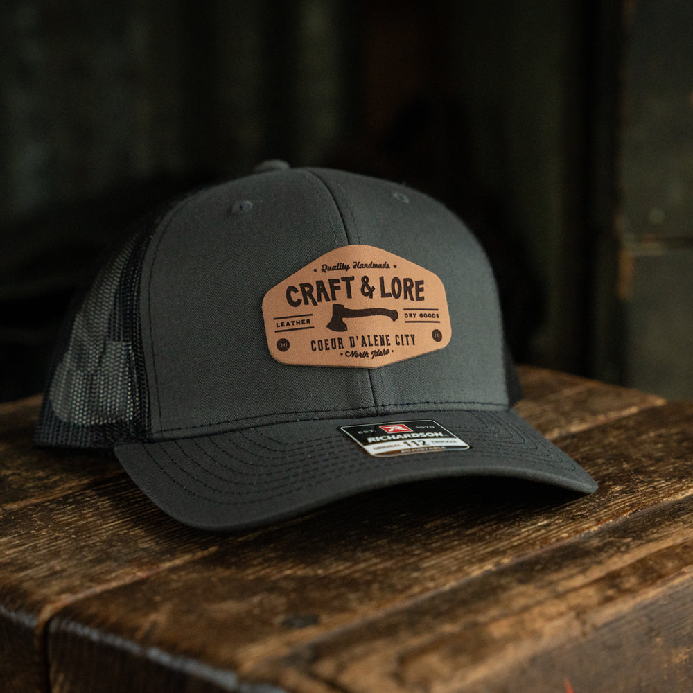 
                  
                    Classic Snapback Richardson 112 hat with leather patch Craft and Lore branding
                  
                