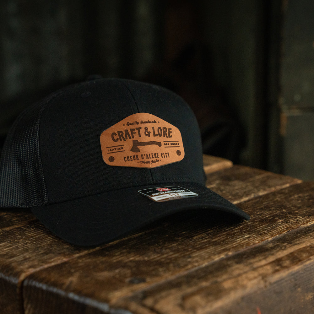
                  
                    Classic Snapback Richardson 112 hat with leather patch Craft and Lore branding
                  
                