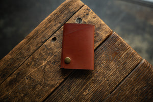 Rollout Wallet has a single pocket for cards, and nicely rolls your cash and secures with a snap