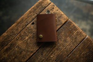 Handmade minimal leather Rollout Wallet has a single pocket for cards, and nicely rolls your cash and secures with a snap