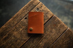 Handmade minimal leather Rollout Wallet has a single pocket for cards, and nicely rolls your cash and secures with a snap