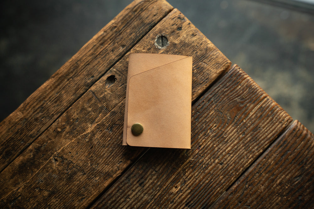 Handmade minimal leather Rollout Wallet has a single pocket for cards, and nicely rolls your cash and secures with a snap