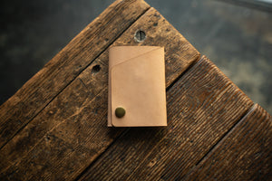 Handmade minimal leather Rollout Wallet has a single pocket for cards, and nicely rolls your cash and secures with a snap