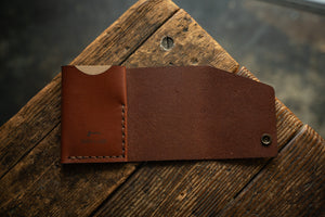 Handmade minimal leather Rollout Wallet has a single pocket for cards, and nicely rolls your cash and secures with a snap