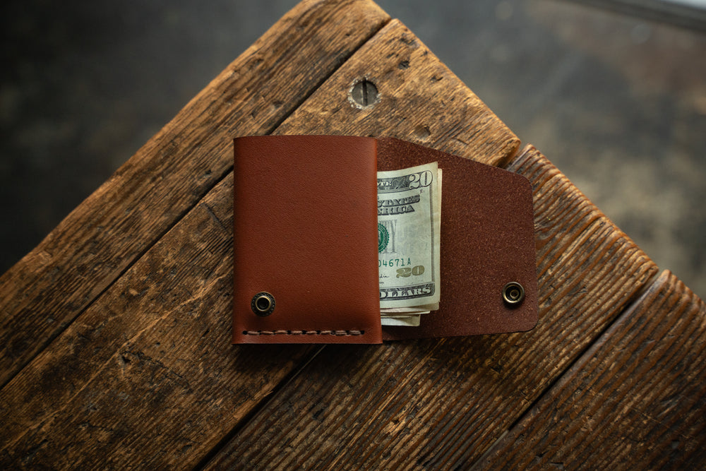 Handmade minimal leather Rollout Wallet has a single pocket for cards, and nicely rolls your cash and secures with a snap