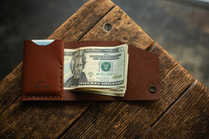 Handmade minimal leather Rollout Wallet has a single pocket for cards, and nicely rolls your cash and secures with a snap