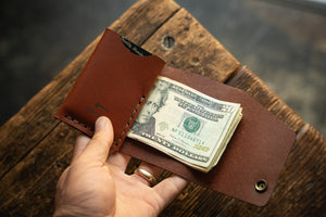 Rollout Wallet has a single pocket for cards, and nicely rolls your cash and secures with a snap