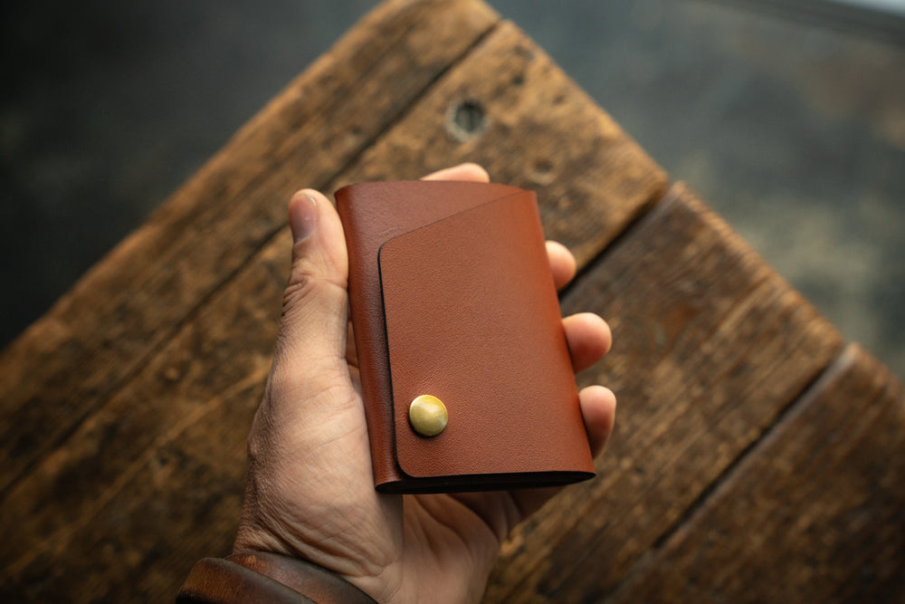 Handmade minimal leather Rollout Wallet has a single pocket for cards, and nicely rolls your cash and secures with a snap