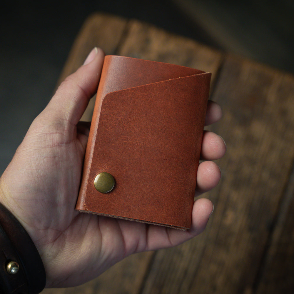 
                  
                    Handmade minimal leather Rollout Wallet has a single pocket for cards, and nicely rolls your cash and secures with a snap
                  
                