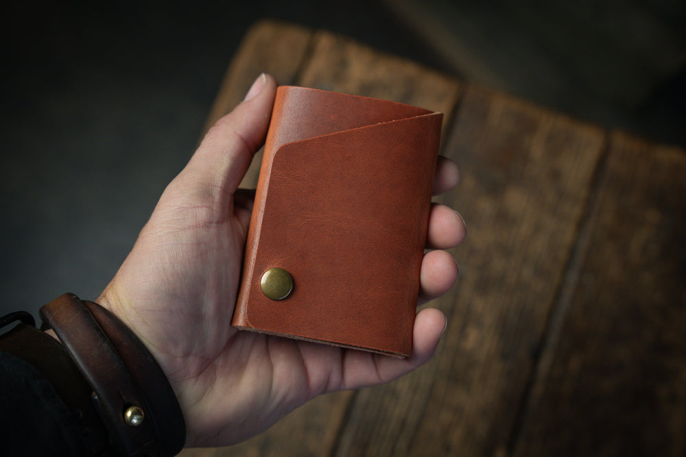 Handmade minimal leather Rollout Wallet has a single pocket for cards, and nicely rolls your cash and secures with a snap