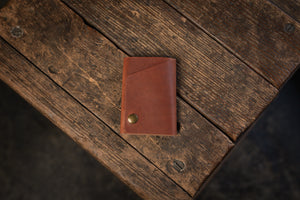 Handmade minimal leather Rollout Wallet has a single pocket for cards, and nicely rolls your cash and secures with a snap