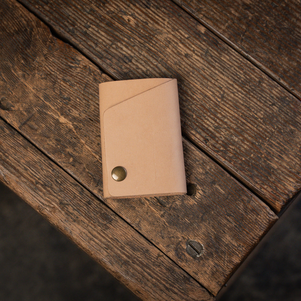 
                  
                    Handmade minimal leather Rollout Wallet has a single pocket for cards, and nicely rolls your cash and secures with a snap
                  
                