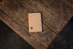 Handmade minimal leather Rollout Wallet has a single pocket for cards, and nicely rolls your cash and secures with a snap