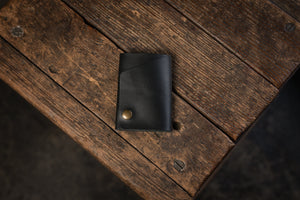 Handmade minimal leather Rollout Wallet has a single pocket for cards, and nicely rolls your cash and secures with a snap