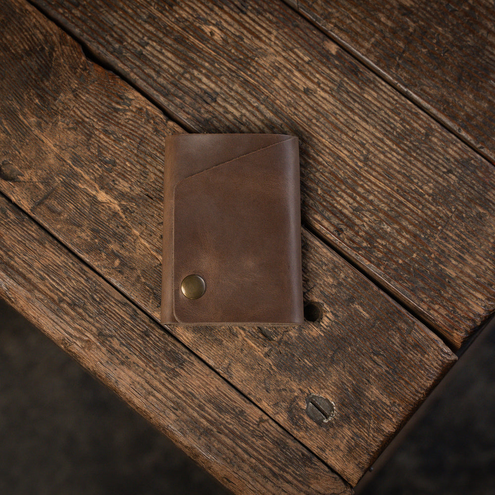 
                  
                    Handmade minimal leather Rollout Wallet has a single pocket for cards, and nicely rolls your cash and secures with a snap
                  
                