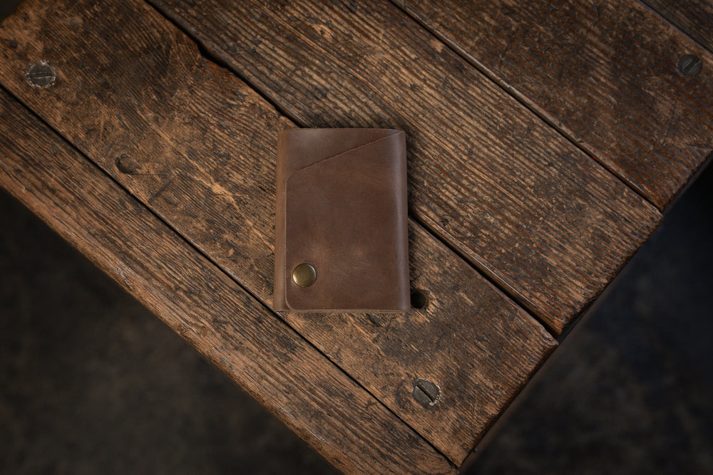 Handmade minimal leather Rollout Wallet has a single pocket for cards, and nicely rolls your cash and secures with a snap