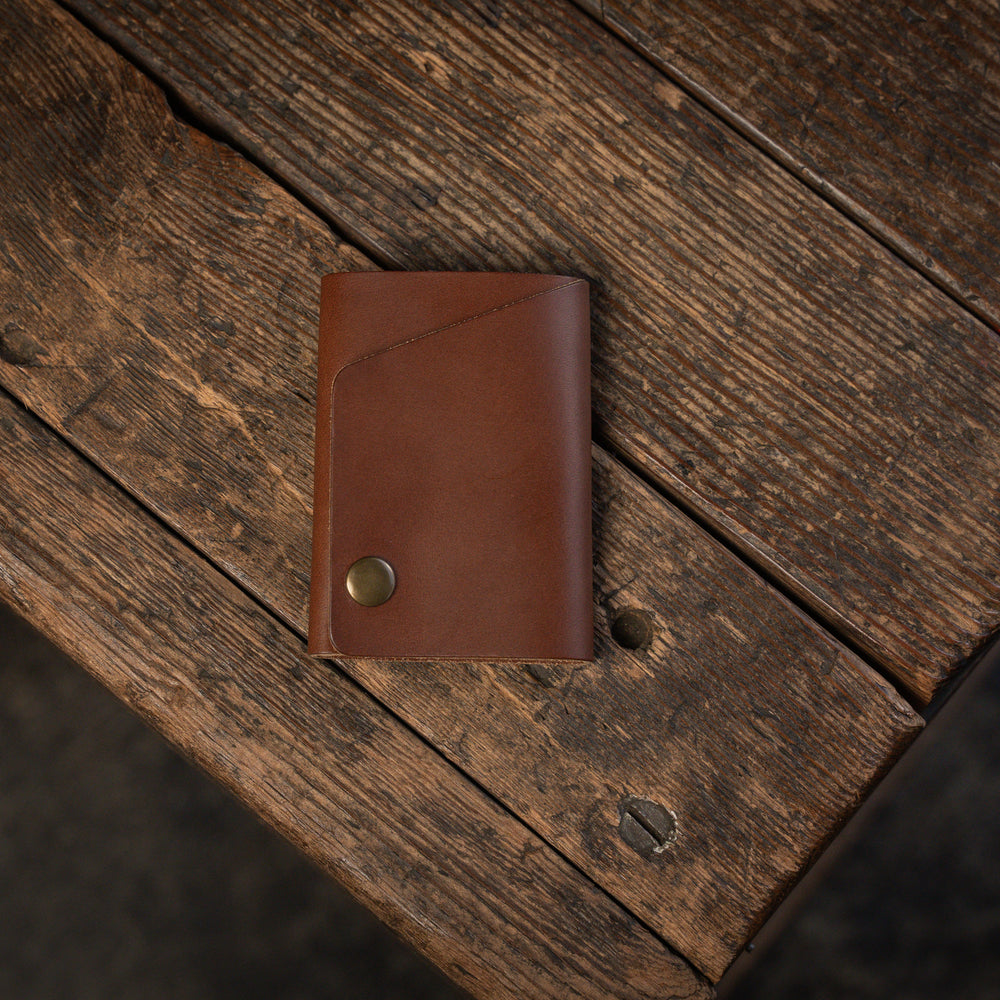 
                  
                    Handmade minimal leather Rollout Wallet has a single pocket for cards, and nicely rolls your cash and secures with a snap
                  
                