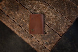 Handmade minimal leather Rollout Wallet has a single pocket for cards, and nicely rolls your cash and secures with a snap