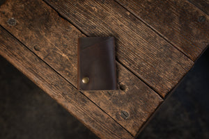 Handmade minimal leather Rollout Wallet has a single pocket for cards, and nicely rolls your cash and secures with a snap