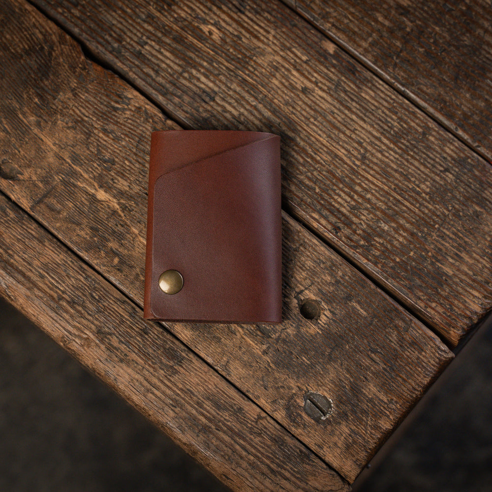 
                  
                    Handmade minimal leather Rollout Wallet has a single pocket for cards, and nicely rolls your cash and secures with a snap
                  
                