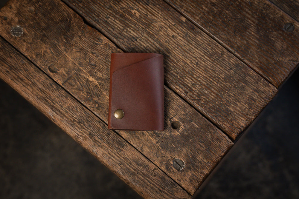 Handmade minimal leather Rollout Wallet has a single pocket for cards, and nicely rolls your cash and secures with a snap