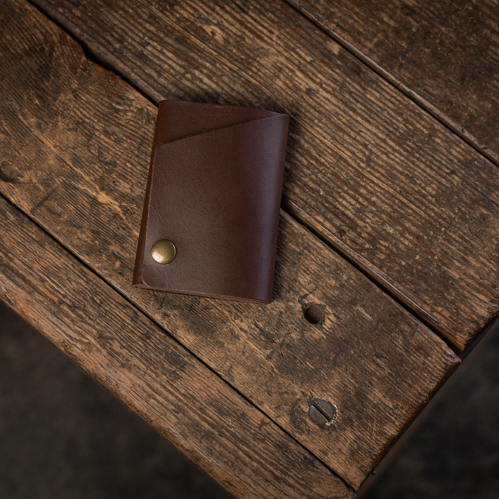 
                  
                    Handmade minimal leather Rollout Wallet has a single pocket for cards, and nicely rolls your cash and secures with a snap
                  
                
