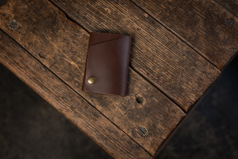 Handmade minimal leather Rollout Wallet has a single pocket for cards, and nicely rolls your cash and secures with a snap