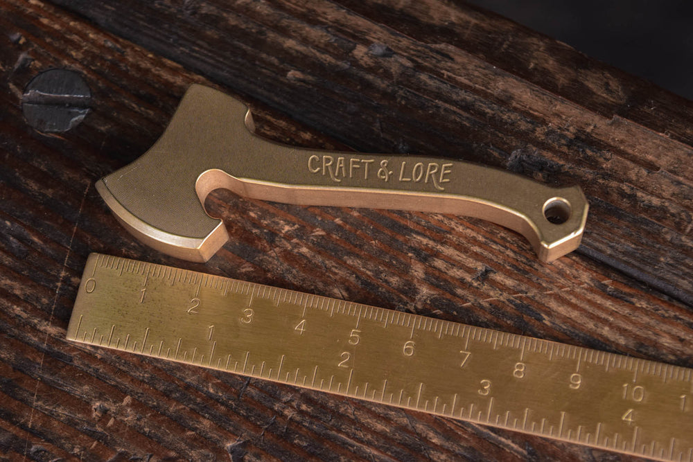 
            
                Load image into Gallery viewer, Bottle Opener Axe Solid Brass USA made EDC Everyday Carry Craft and Lore Quality Machined PNW Northwest 
            
        
