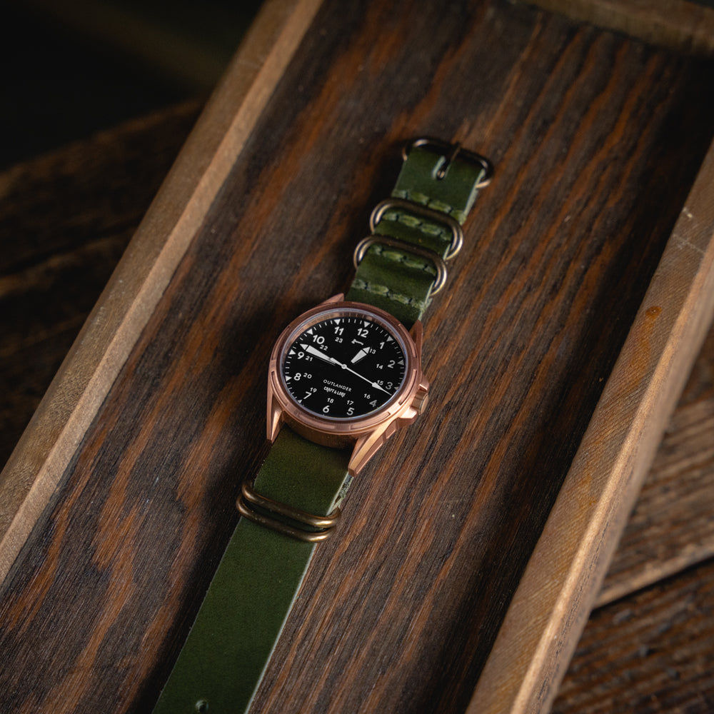 
                  
                    OUTLANDER Bronze Watch USA Swiss Quartz Sapphire Crystal Craft and Lore Olive Green Leather NATO Strap
                  
                
