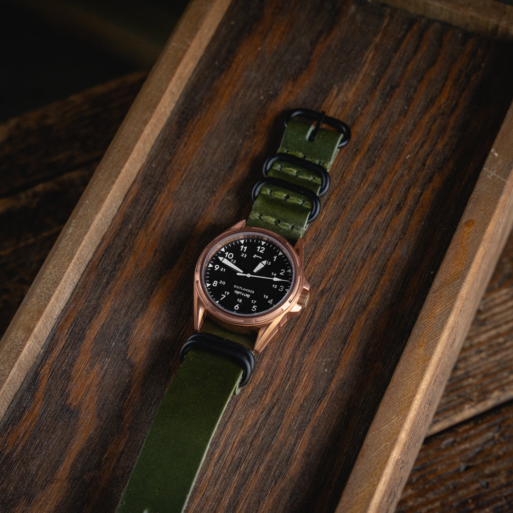 
                  
                    OUTLANDER Bronze Watch USA Swiss Quartz Sapphire Crystal Craft and Lore Olive Green Leather NATO Strap
                  
                