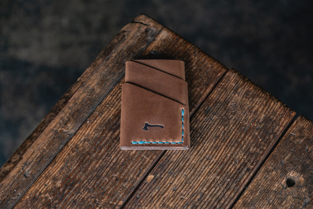 
            
                Load image into Gallery viewer, Port Wallet, Horween Chromexcel Natural hand stitched with turquoise blue thread
            
        