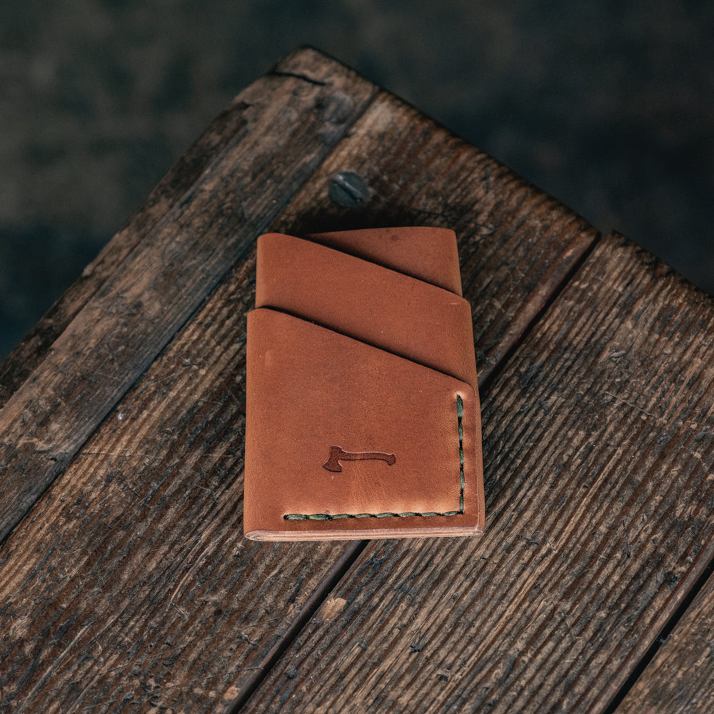 
                  
                    Port Wallet Craft and Lore, Horween Dublin English Tan and hand stitched with olive green thread
                  
                